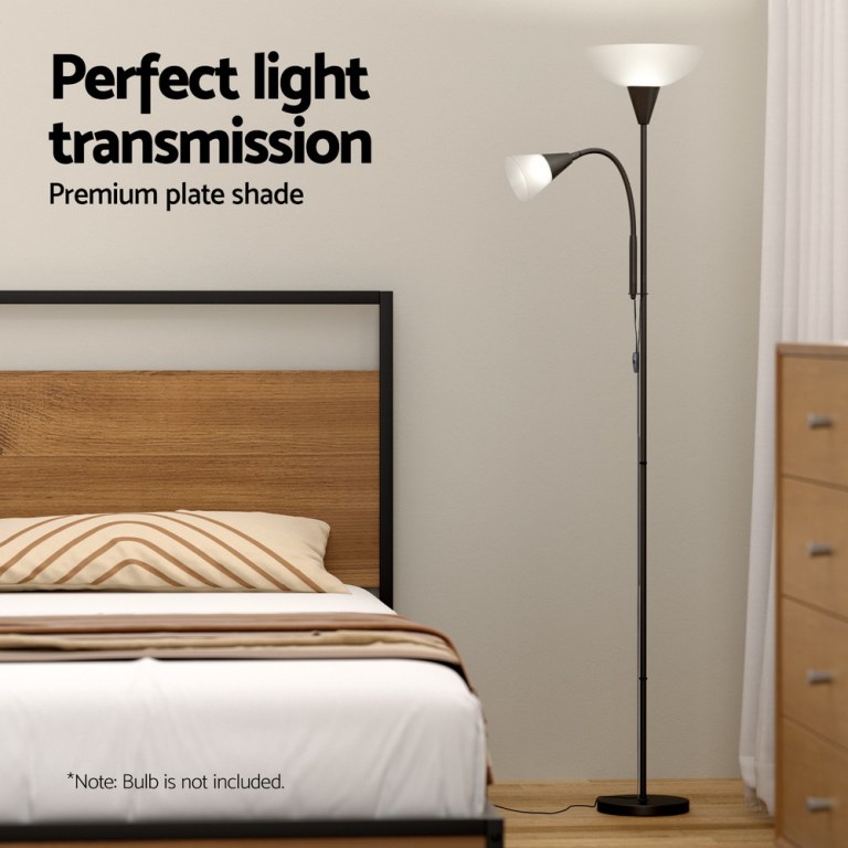 Modern floor lamp beside bed in bedroom