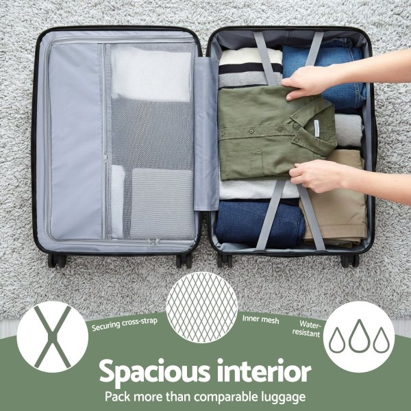 Open suitcase neatly packed with folded clothes