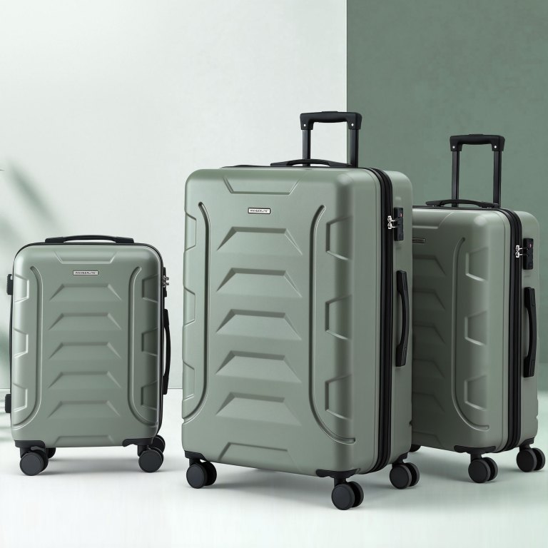 Three sage green hard-shell suitcases with wheels