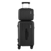 Stacked black hard-shell suitcases with wheels