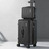 Black hard-shell suitcases with wheels and handle