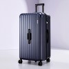 Dark blue hard-shell suitcase with spinner wheels
