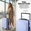 wanderlite 28 wide handle luggage suitcase travel tsa lock light blue" Traveller with suitcase featuring wider balanced handle