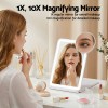 Woman applying lipstick using 1X 10X magnifying mirror