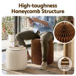 Man sitting on honeycomb structure stool indoors