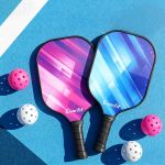 everfit pickleball paddle set fibreglass racquet honeycomb core with bag Two Everfit pickleball paddles with balls on court