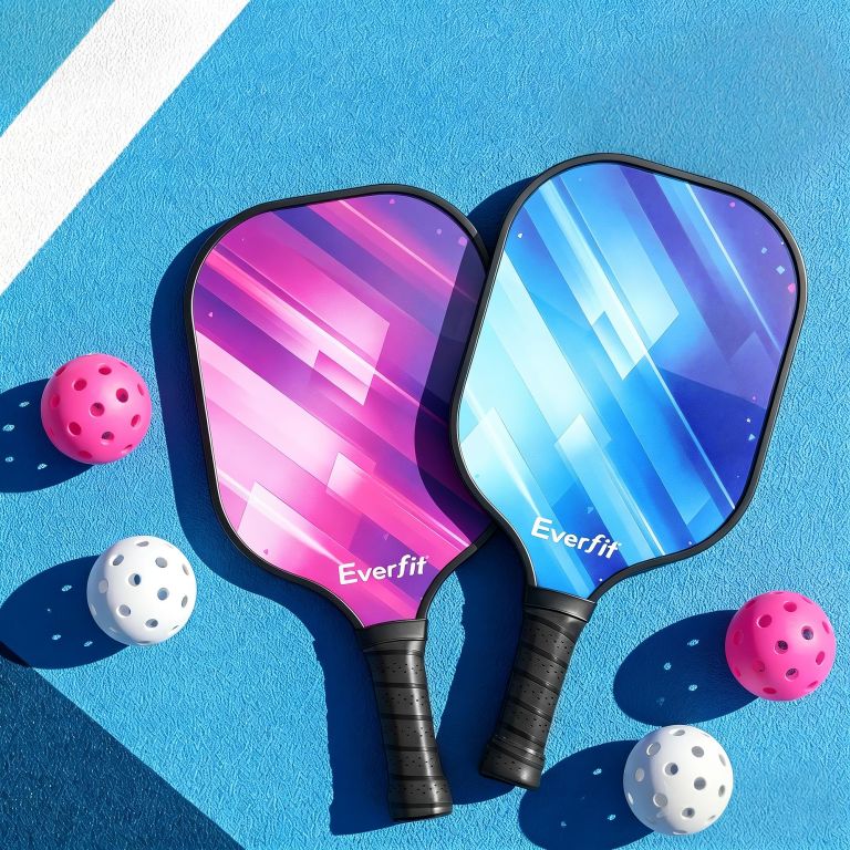 everfit pickleball paddle set fibreglass racquet honeycomb core with bag Two Everfit pickleball paddles with balls on court