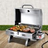 Portable stainless steel gas barbecue with steaks and skewers