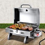 pgb 1b hp ss ab 202502281648 00.jpg Portable stainless steel gas barbecue with steaks and skewers