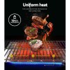 Steaks grilling over high-heat gas barbecue