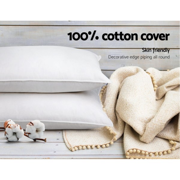 White cotton pillows with beige throw blanket