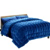 quilt fm teal sk 17759 00.jpg Blue quilted bedspread on wooden bed frame