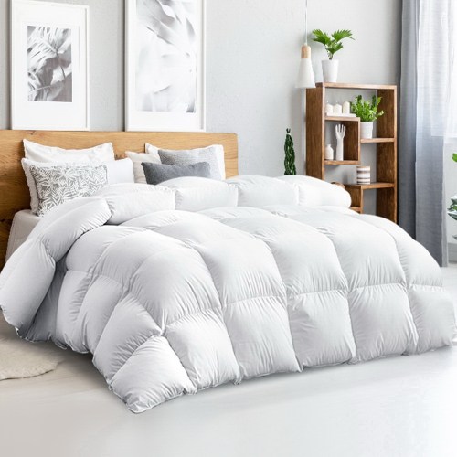 Fluffy white doona on modern bedroom bed