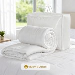 White quilt with storage bag on bed