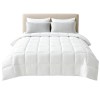 White quilted doona on neatly made bed