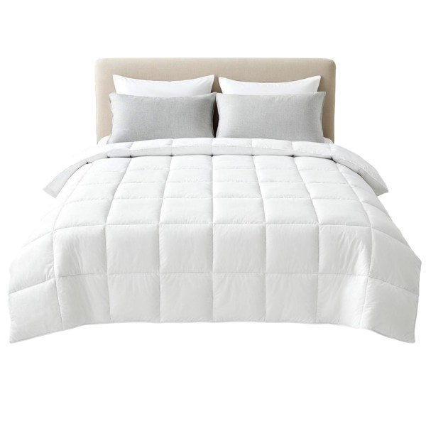 White quilted doona on neatly made bed