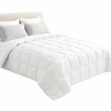 White quilted doona on neatly made bed