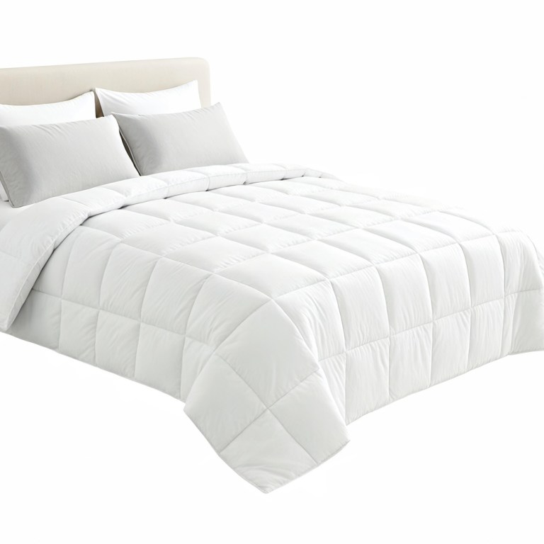 White quilted doona on neatly made bed