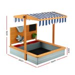 Wooden kids sandbox with striped canopy cover
