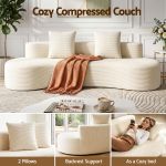Cream ribbed compressed couch with pillows and throw