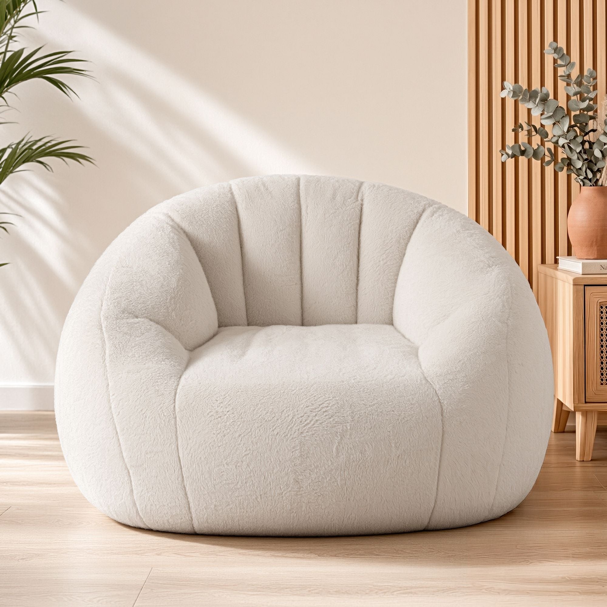 Cream boucle armchair in sunlit minimalist living room