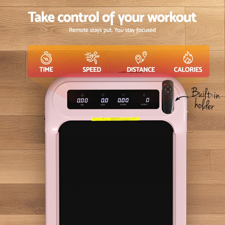 Pink treadmill with display and built-in remote holder