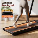 everfit 3 in 1 walking pad treadmill with led lights foldable under desk treadmills for home gym 40cm wide belt black Person walking on cushioned treadmill at home