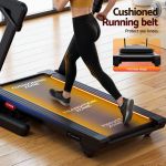 Person walking on cushioned home treadmill belt