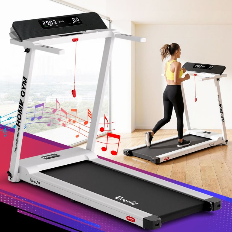 Woman jogging on Everfit home treadmill indoors