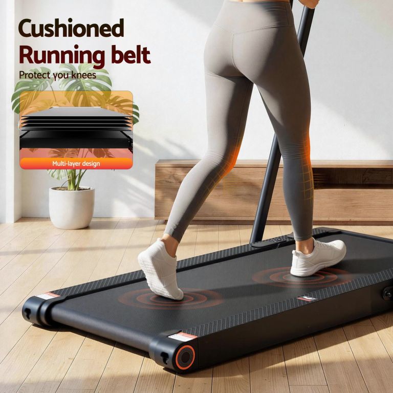 Woman walking on cushioned treadmill at home