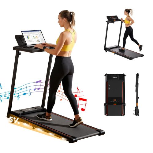 tmill titan42 dt 00.jpg Woman walking on treadmill desk with laptop