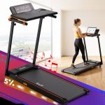Woman using under-desk treadmill with laptop