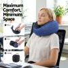 Woman using blue travel neck pillow at desk