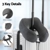 Grey travel neck pillow on suitcase handle