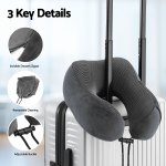 Grey travel neck pillow on suitcase handle