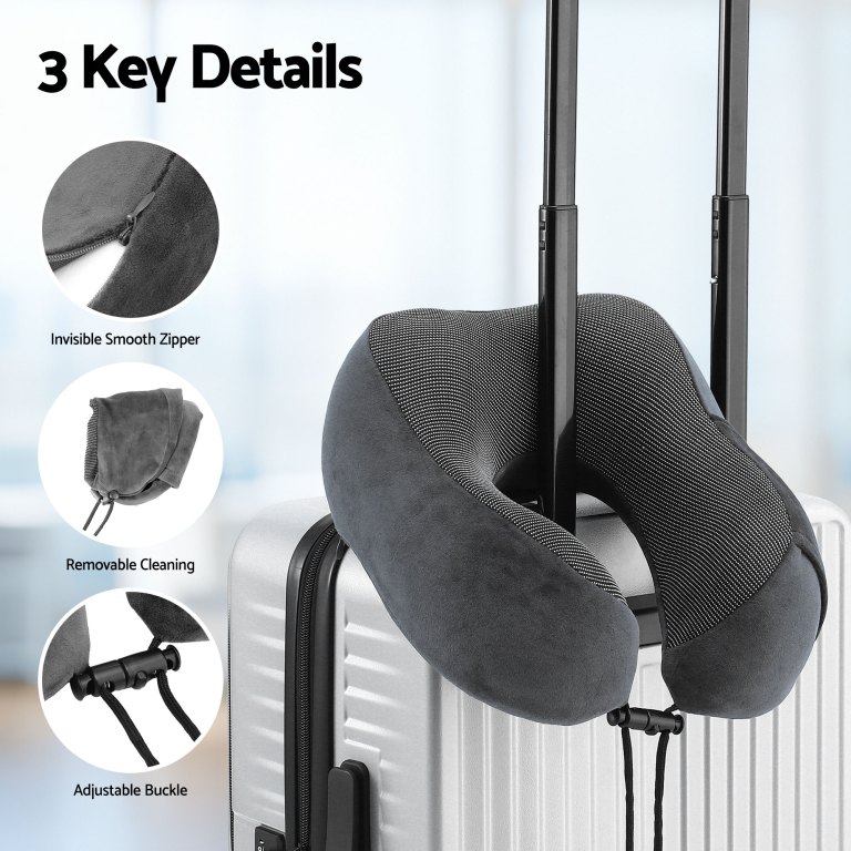 Grey travel neck pillow on suitcase handle