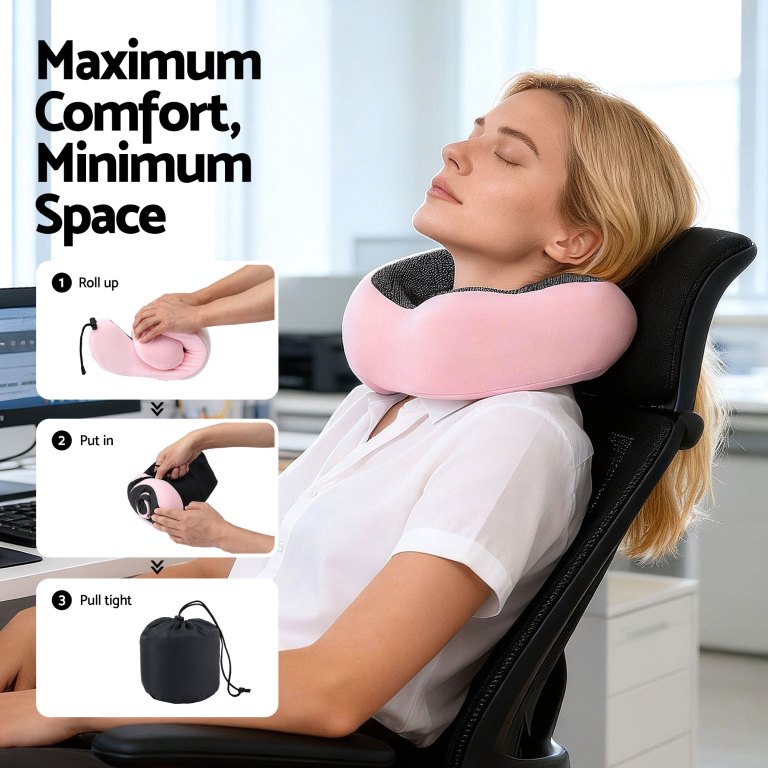 Woman using pink travel neck pillow in office