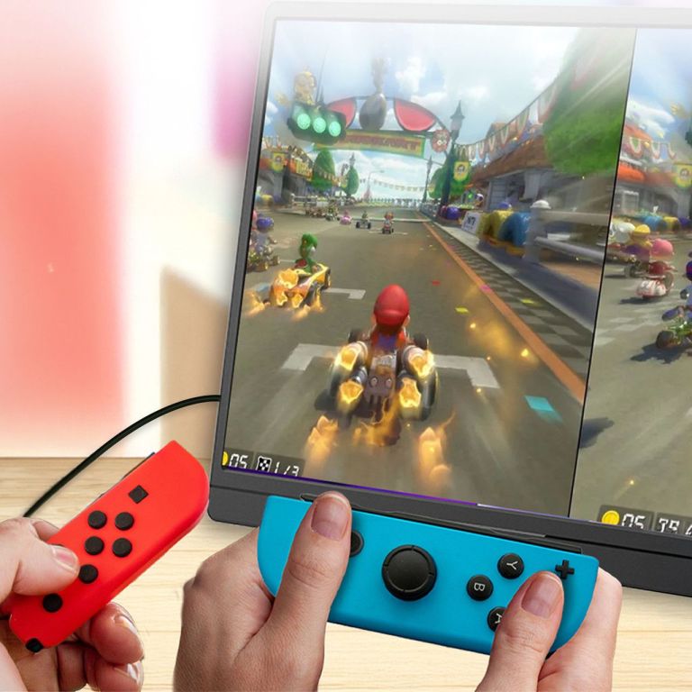 laser 15.6 inch portable monitor with usb c and hdmi Hands playing Mario Kart on Nintendo Switch