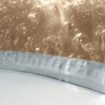 Close-up of fermenting liquid with bubbles in jar