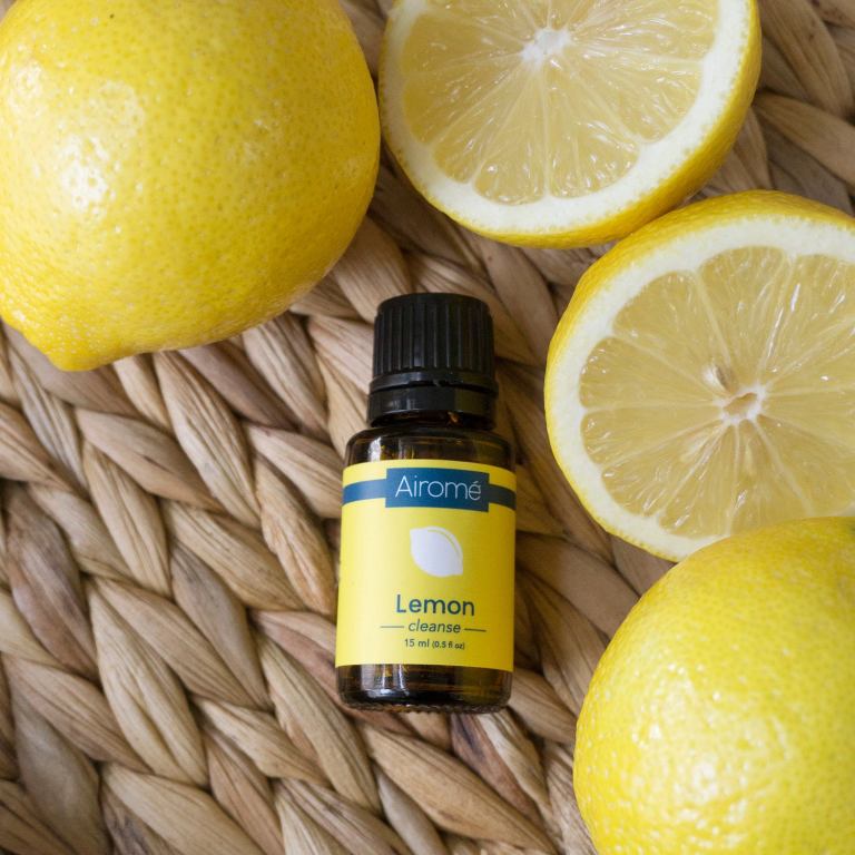 lemon essential oil Lemon essential oil bottle with fresh lemons