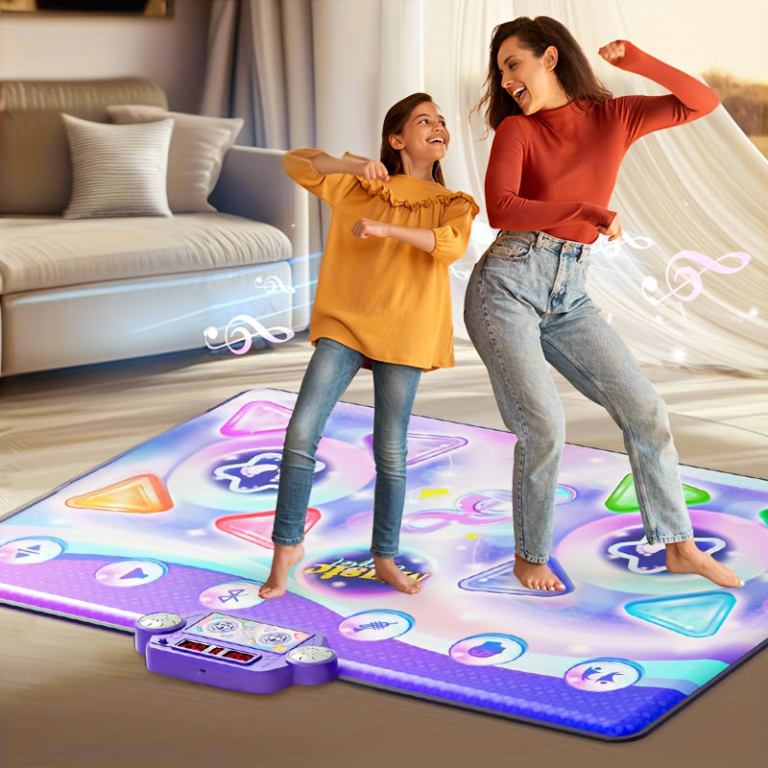 Woman and girl dancing on interactive play mat