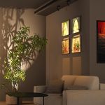 Modern living room with sofa, artwork and plant