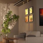 Modern living room with sofa, plant and artwork
