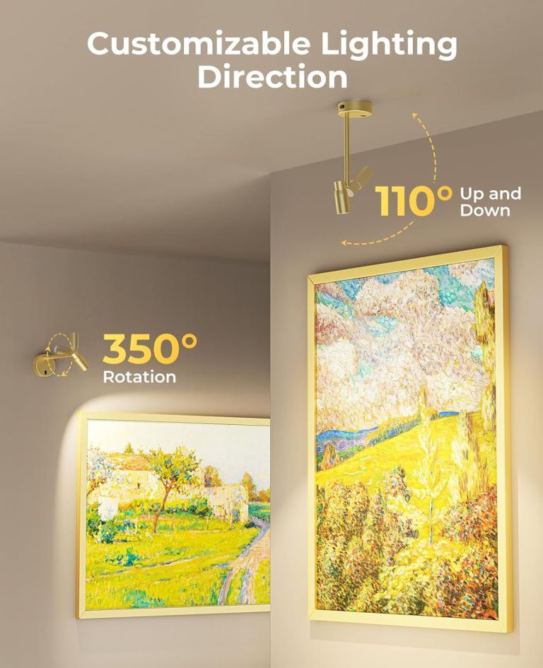 Adjustable gold spotlight illuminating framed wall art