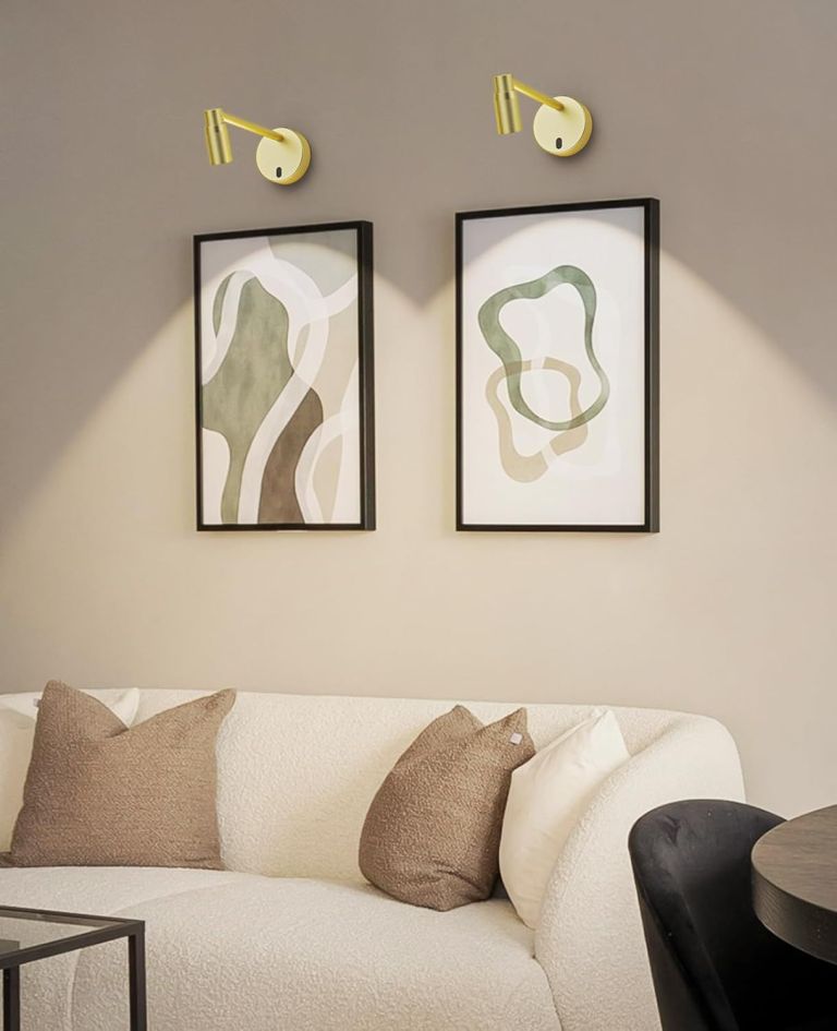 Modern living room with abstract art and sconces