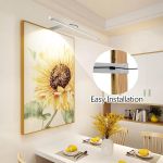 Wall-mounted picture light above sunflower painting
