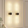 Modern vertical LED wall sconces on beige wall