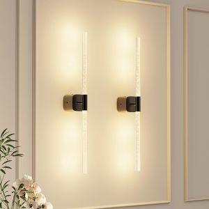 Modern vertical LED wall sconces on beige wall