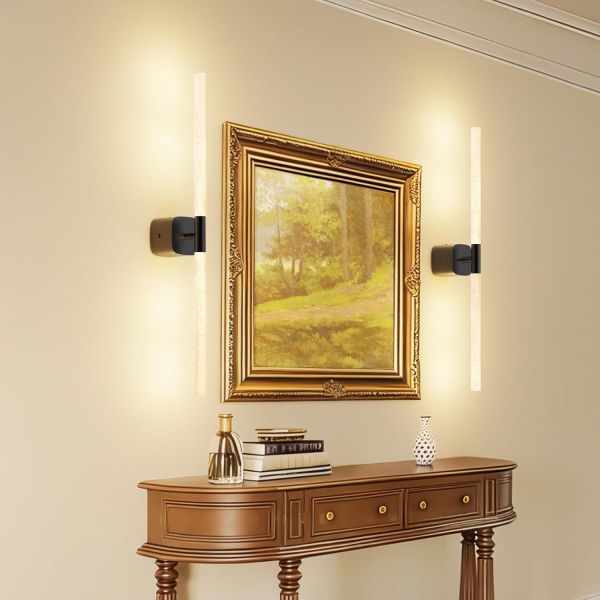 Framed landscape painting with modern wall sconces