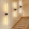 Modern LED wall lights along staircase